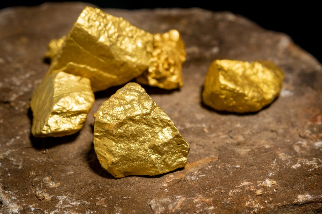 The pure gold ore found in the mine on a stone floor